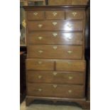 An 18th century oak chest-on-chest, the upper part with moulded cornice, above three small and three