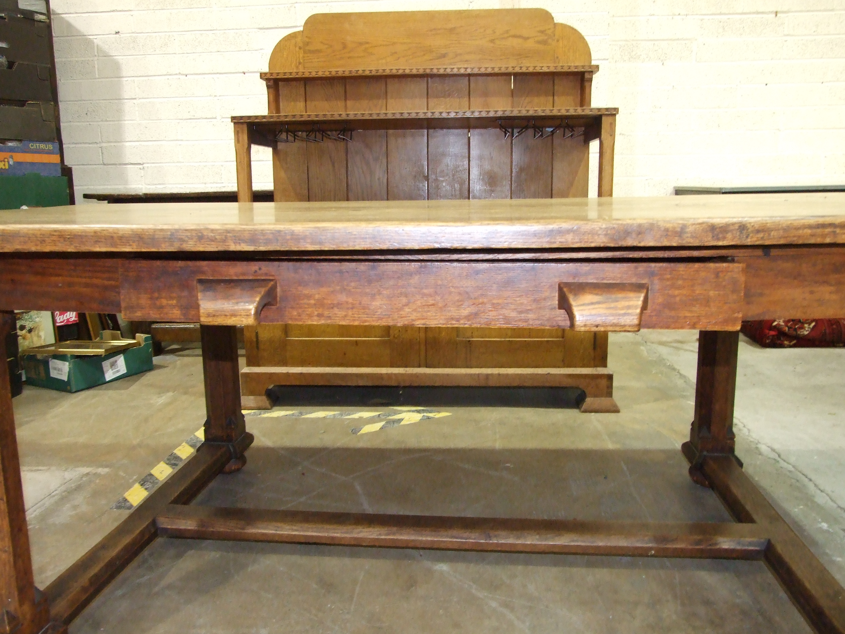 An early-20th century Arts & Crafts oak dining table, the plank top above a single frieze drawer, on - Image 2 of 10