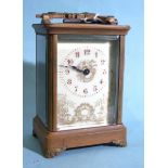 A 19th century French brass carriage clock, the gilt and cream dial with red Arabic numerals, the