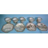 A collection of Japanese eggshell porcelain cups and saucers decorated with figures in