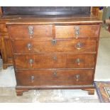 An antique oak chest of two short and three long drawers, on bracket feet, 99cm wide, 90cm high.