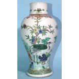 A 19th century Chinese famille verte vase decorated with a crane standing in flowering shrubs, 23cm,