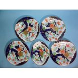 Four early-19th century Coalport Imari pattern plates and a matching oval dish, (two plates