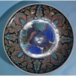 A large Burmantofts Faience Iznik-style charger decorated with an eagle within a floral border, (rim