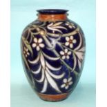 A Royal Doulton stoneware baluster-shaped vase by Harry Simeon, with stylised floral and leaf