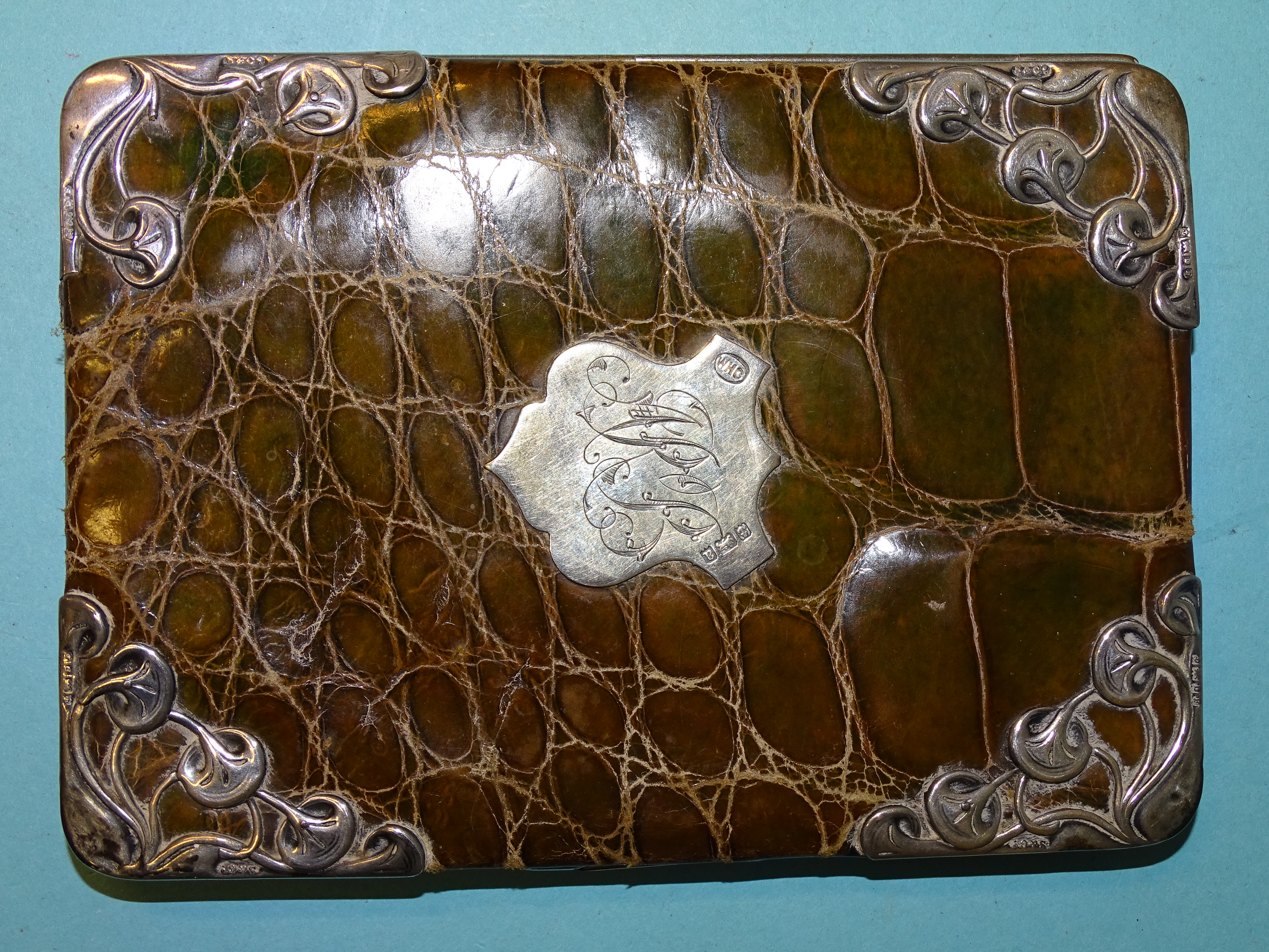 An Art Nouveau silver-mounted green crocodile skin wallet, Birmingham 1900, 14 x 10cm. - Image 2 of 5