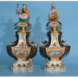 A pair of Paris porcelain large perfume bottles and stoppers decorated with panels of birds and