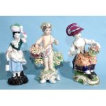 A Derby porcelain figure of a seated lady with flowers, a Derby figure of a putto with flowers and a