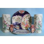 A pair of Chinese famille rose cylindrical vases, a large Imari charger, a small pair of Imari vases