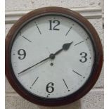 A late-19th/early-20th century institutional circular wall clock, the repainted metal dial with