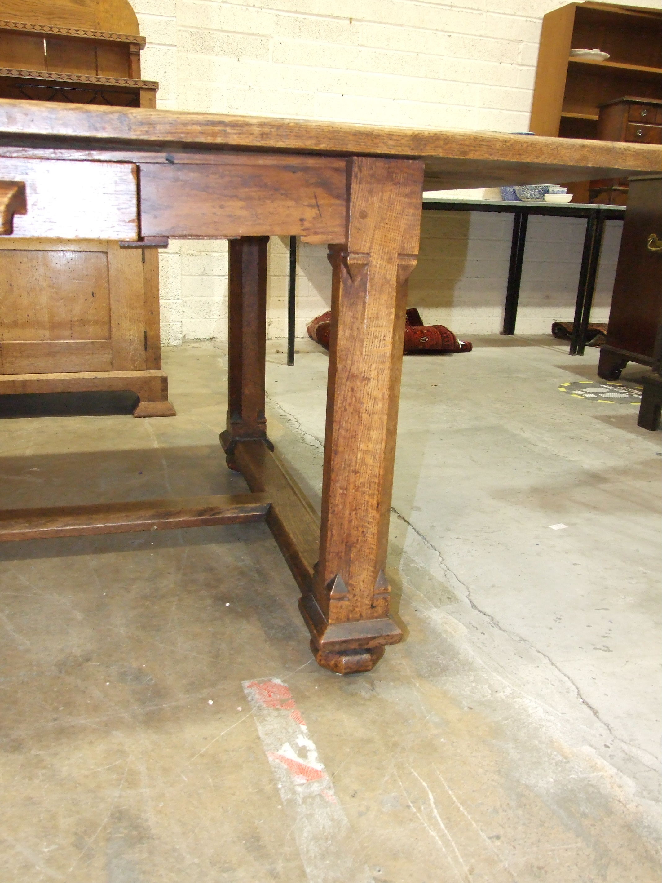 An early-20th century Arts & Crafts oak dining table, the plank top above a single frieze drawer, on - Image 4 of 10