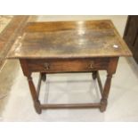 An antique oak side table, the rectangular top above a drawer, on turned legs, 80cm wide, 70cm