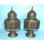 A pair of Egyptian pierced metal hanging lanterns, 29cm high, (2).