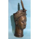 A mid-20th century Benin-style bronze sculpture cast as a female head, 56cm high.