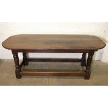 An antique oak farmhouse table, (repaired, altered and feet blocked), 203 x 80cm.