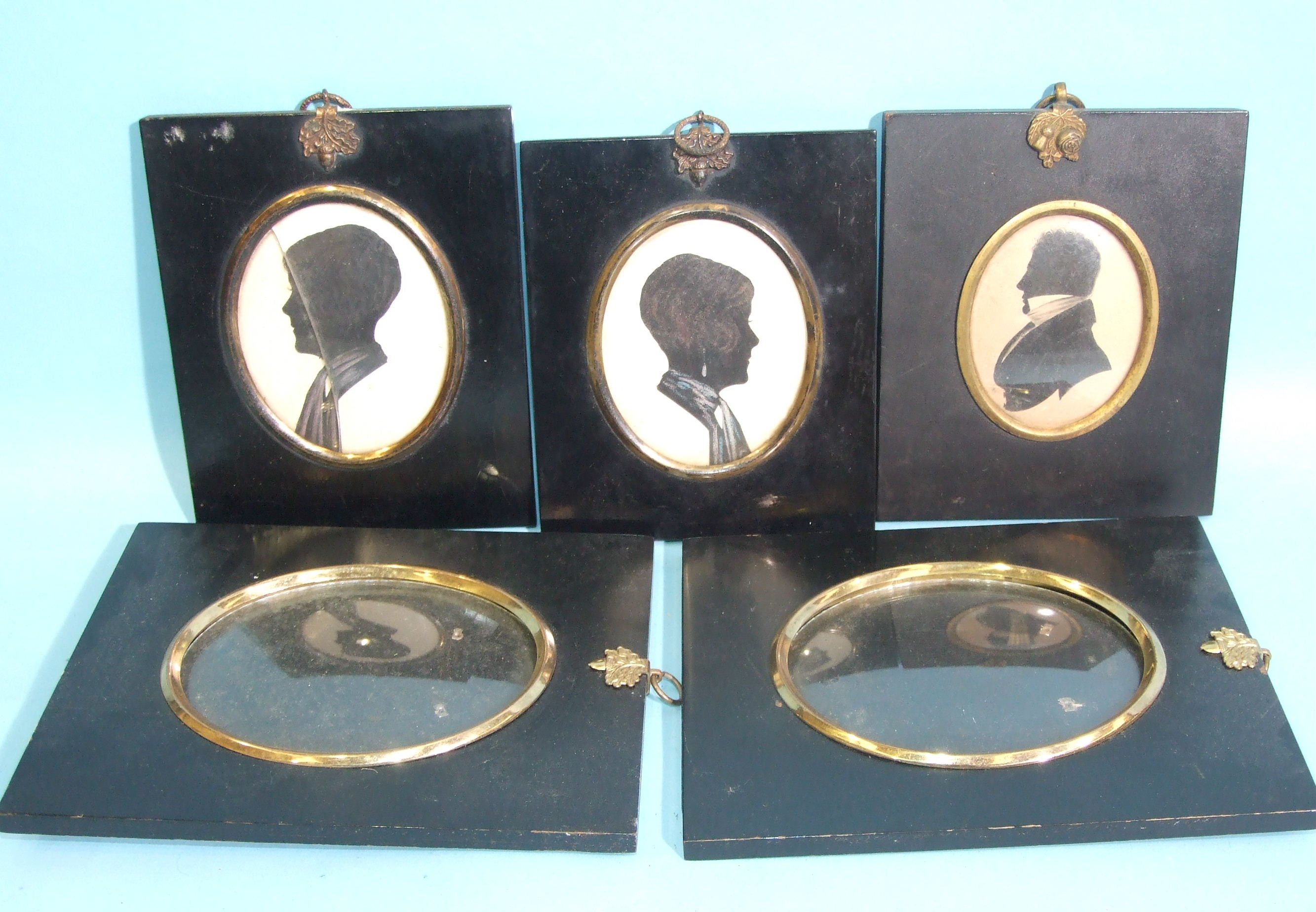 A 19th century silhouette portrait of a gentleman, 7.5 x 6cm, two early-20th century silhouette