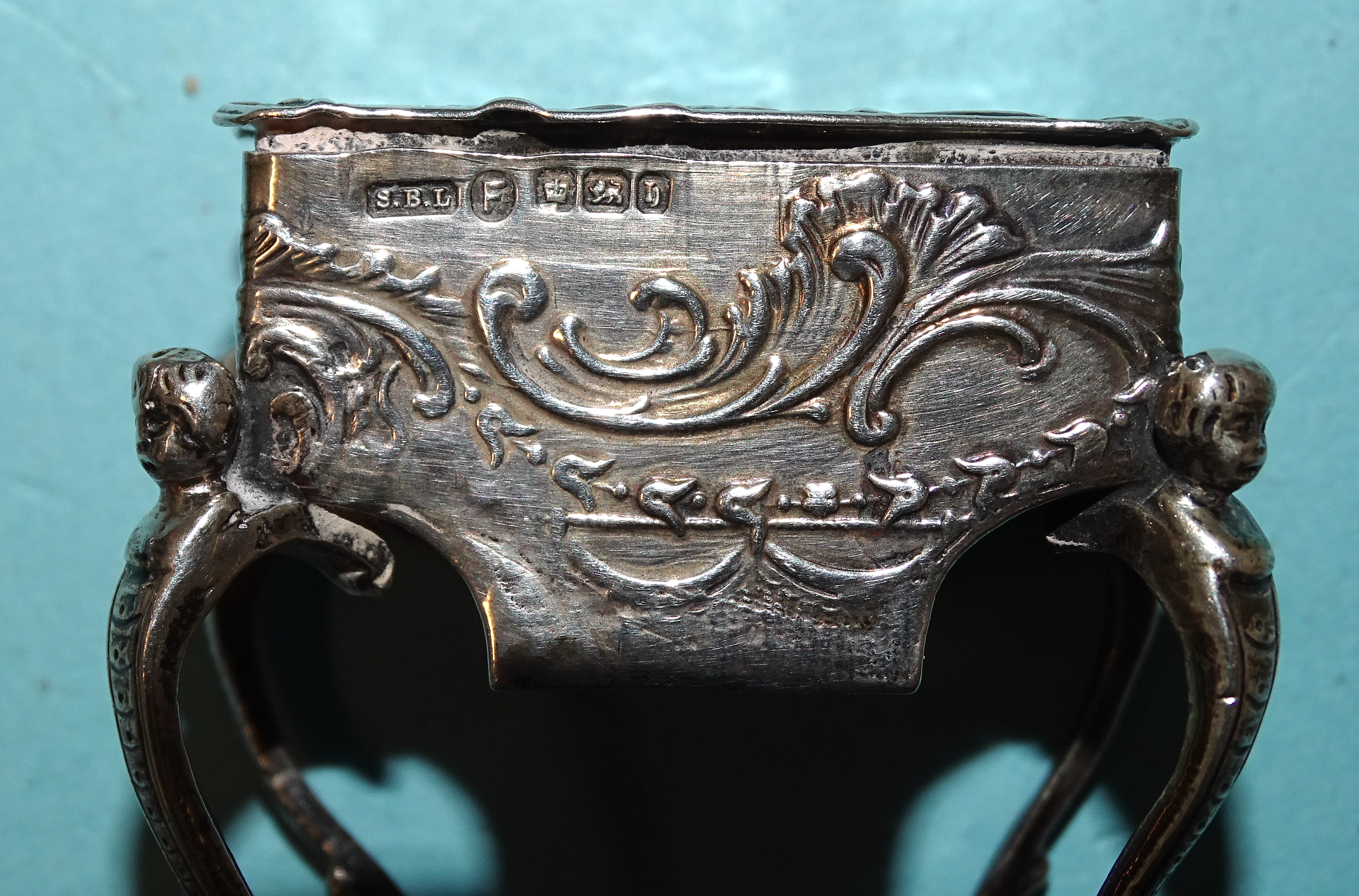 A Continental silver pill box in the form of a worktable, on cabriole legs, with embossed - Image 5 of 11