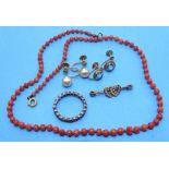 A string of graduated coral beads, a small ring of two seed pearl-set hearts, two pairs of 9ct