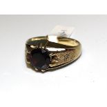 A gent's 9ct gold ring set garnet, size Y, 7.9g.