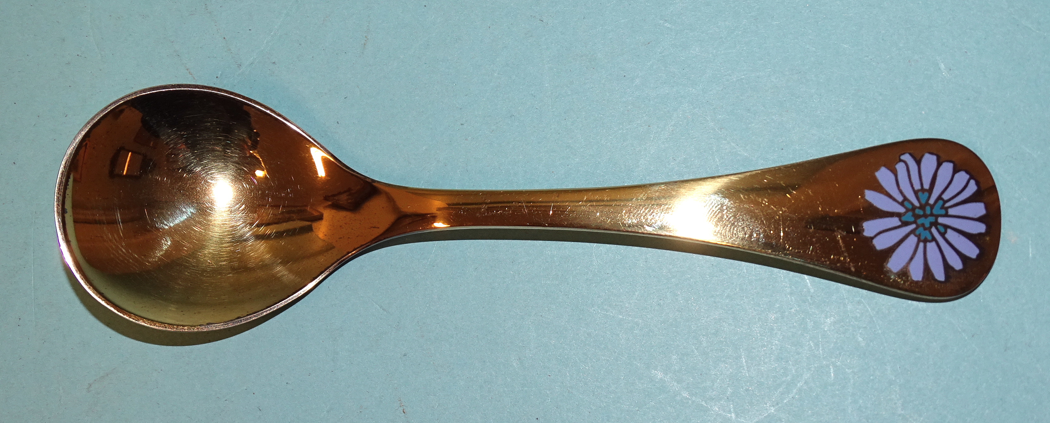 A silver gilt 1980 spoon with enamel flower, maker's mark RA AB, Georg Jensen, ___5.39oz.