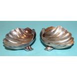 A pair of silver salts of shell form on two shell feet, by Alfred Dunhill & Sons, London 1972,