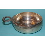 A silver porringer of plain form with a pair of snakes forming the handle, Alfred Dunhill & Sons,