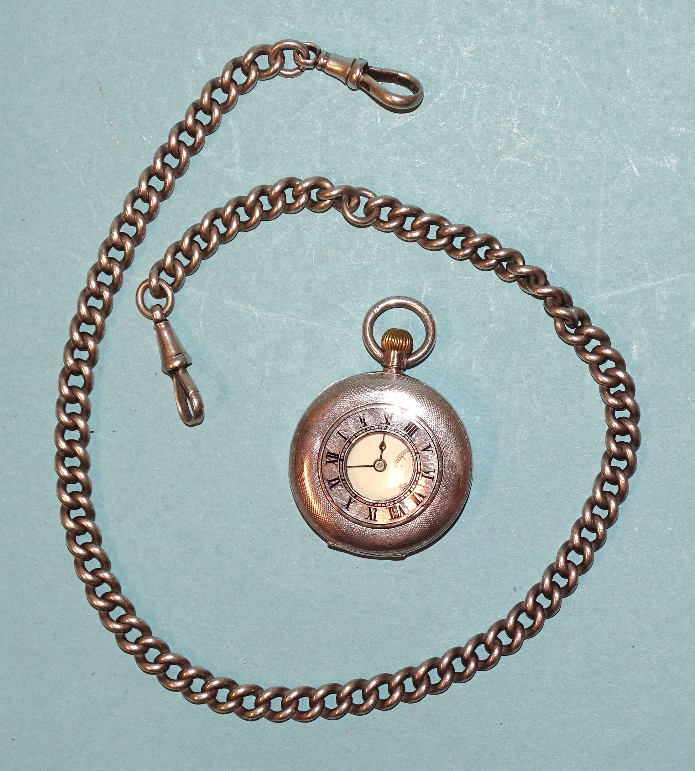 A lady's silver half-hunter-cased pocket watch, (not working), London import marks for 1910, 35mm