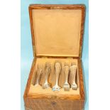 A canteen of sterling silver cutlery by J A Merrill & Co, twelve each, tablespoons, dessert