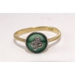 An Edwardian ring set three 8/8-cut diamonds in shamrock or clover leaf design, on circular