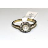 A diamond and pearl cluster ring set eleven old-cut diamonds around a cultured pearl, in 18ct gold