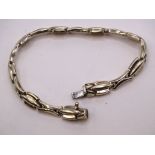A 9ct gold bracelet of fancy links, with concealed clasp, 19cm, 8.9g.