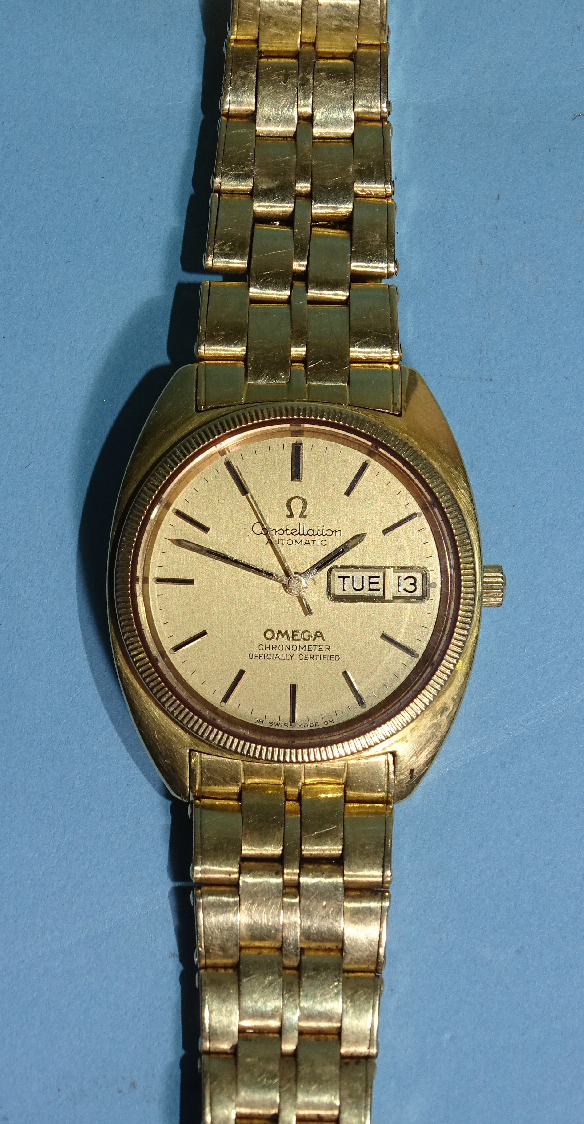 Omega, a gentleman's Constellation Automatic 18ct gold wristwatch, the brushed gold dial with