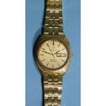 Omega, a gentleman's Constellation Automatic 18ct gold wristwatch, the brushed gold dial with