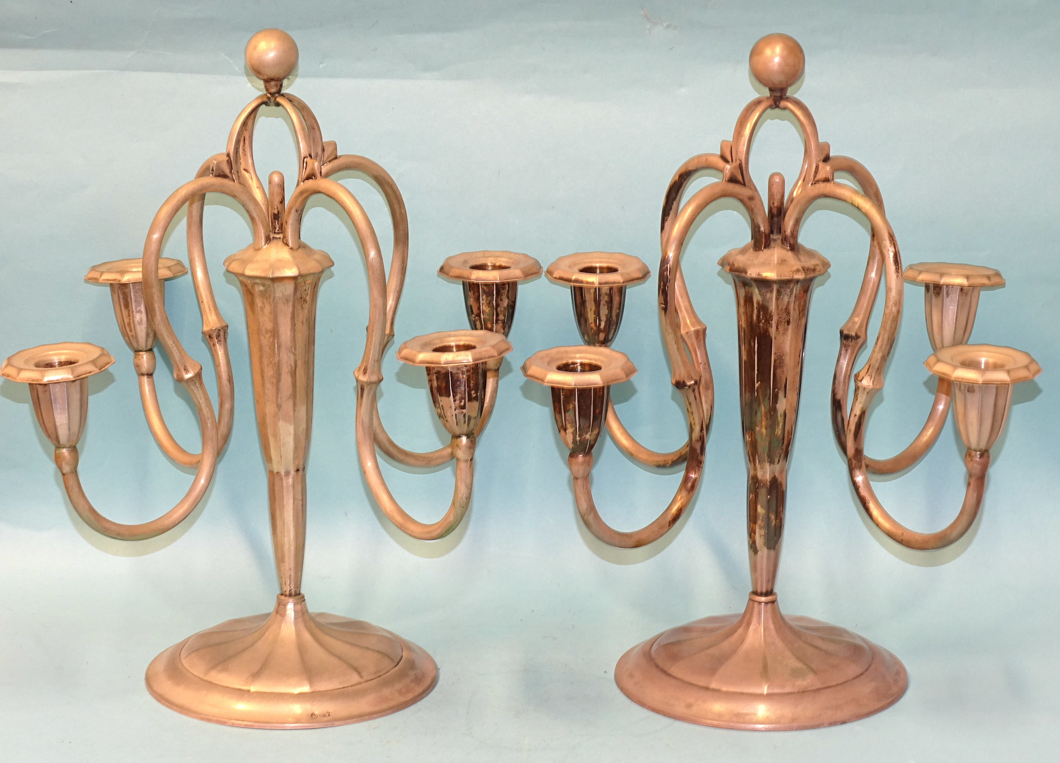 A pair of German 800-silver four-branch candelabra on loaded bases, 33.5cm high.