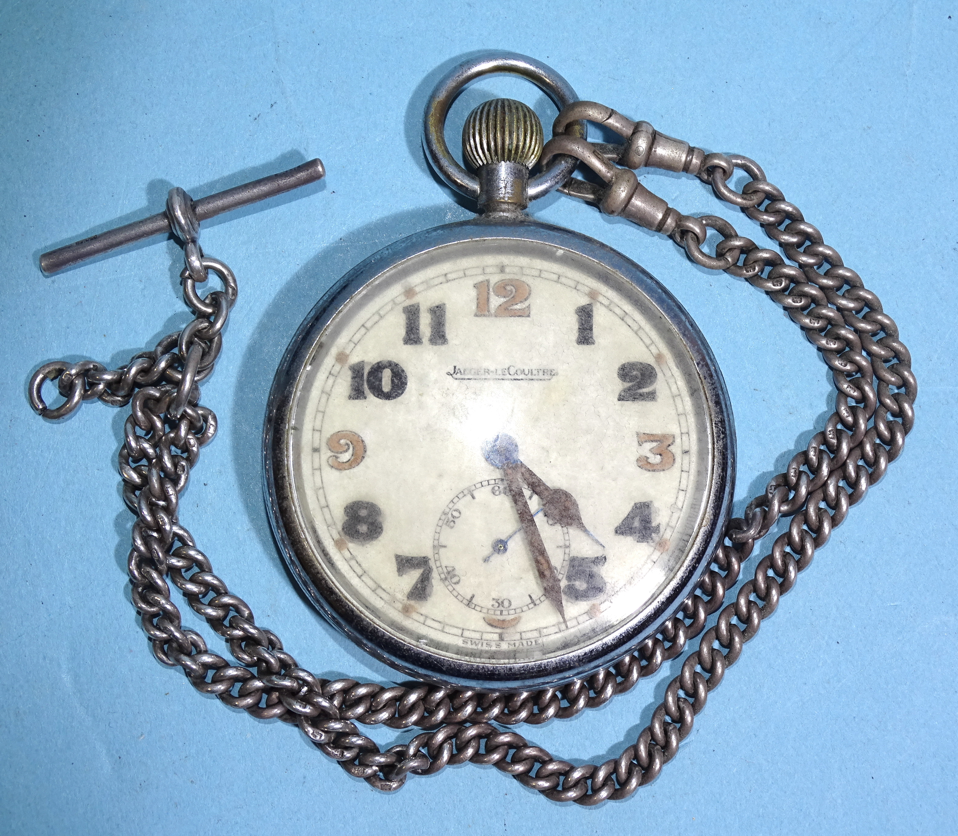 A Jaeger LeCoultre GSTP military pocket watch, the off-white enamel dial with Arabic numerals and