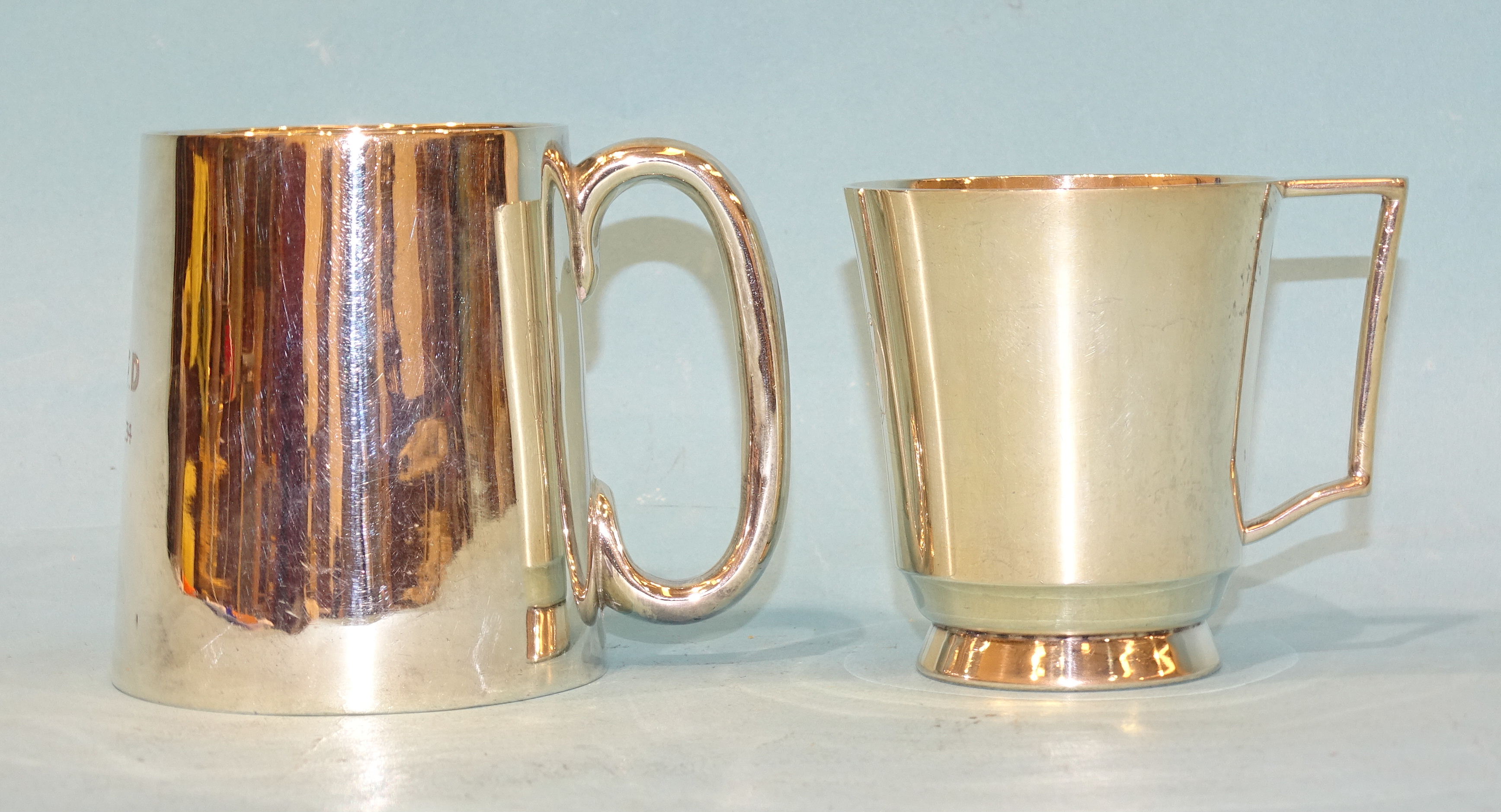 A small silver tankard of tapered form with ‘C’ handle, Brook & Son, Edinburgh 1935 and another by S