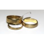 Two 9ct gold wedding bands and another 9ct gold ring set white synthetic stones, sizes M½, S and