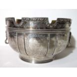 A large silver two-handled punch bowl of circular form on ribbed foot, with five panels in the