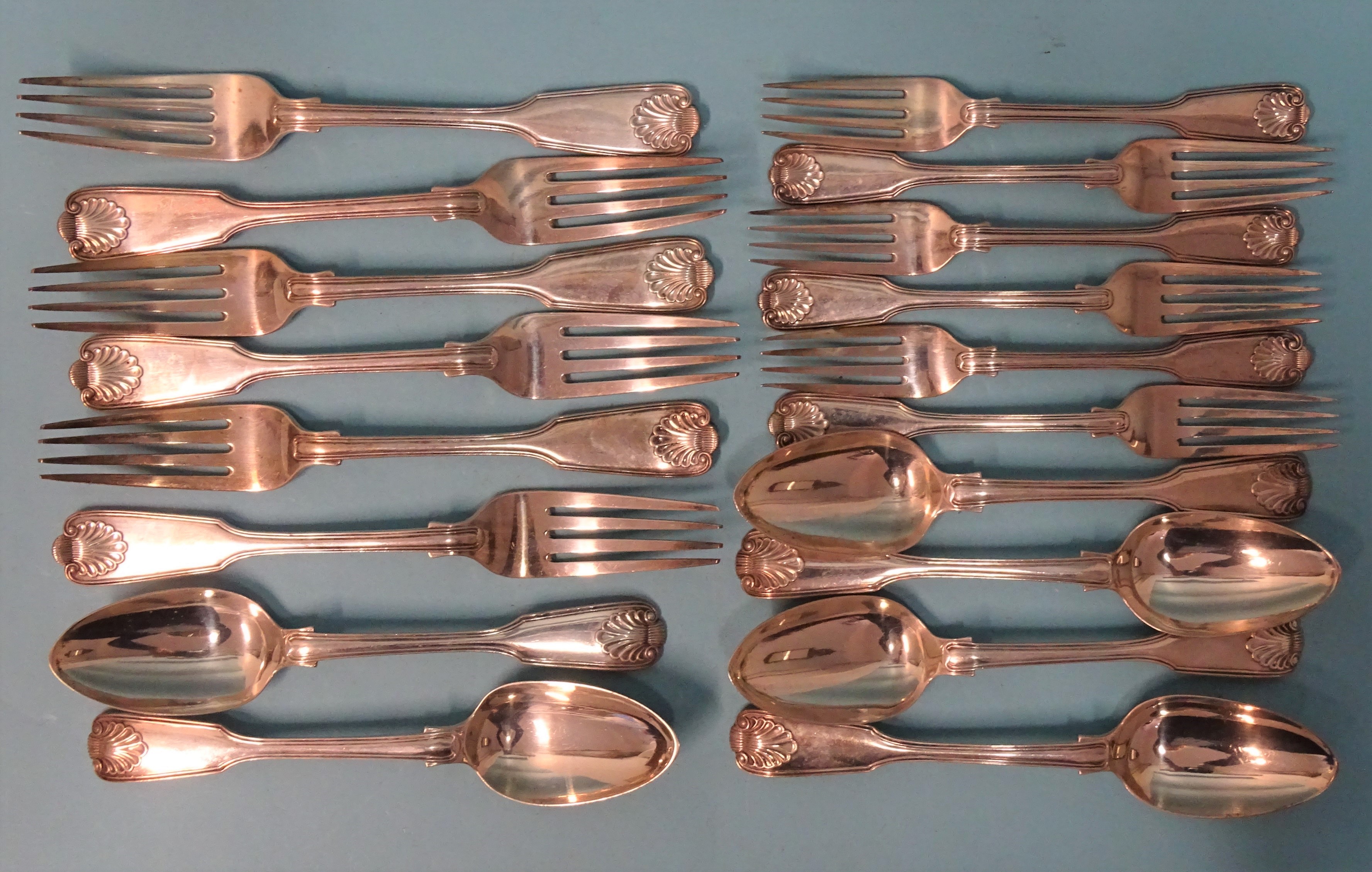 A quantity of Victorian silver fiddle, thread and shell cutlery: six each table and dessert forks,