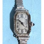 A lady's Art Deco diamond-set manual wrist watch, the 9ct white gold octagonal case set 32 rose-