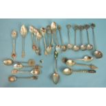 A collection of twenty-three foreign silver and white metal souvenir teaspoons.