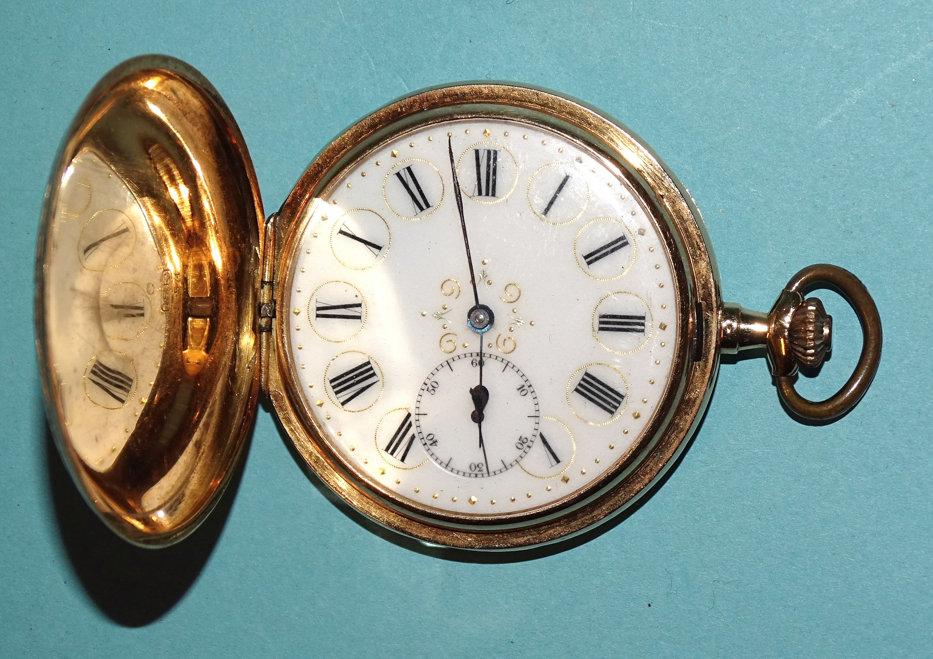 Rueff Freres, an 18ct gold hunter-cased pocket watch, the white enamel dial with Roman numerals,