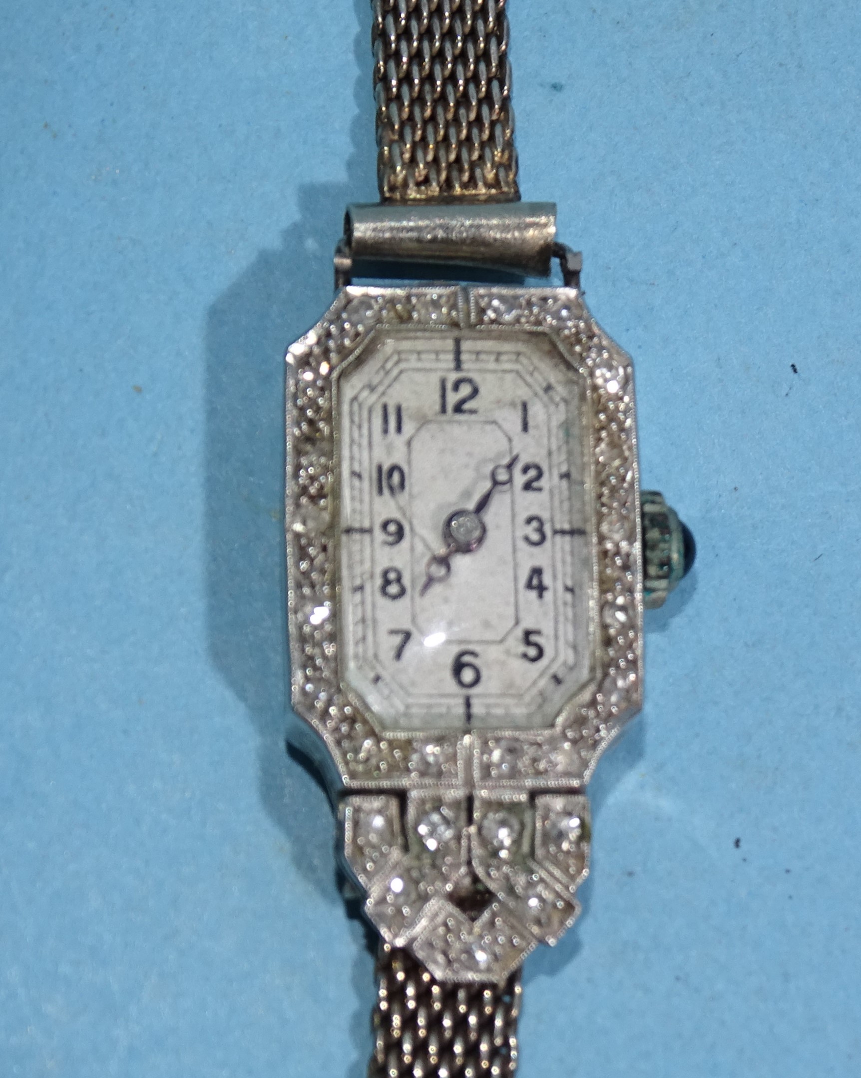 A lady's Art Deco diamond-set manual wrist watch, the platinum octagonal case set twenty-five 8/8-