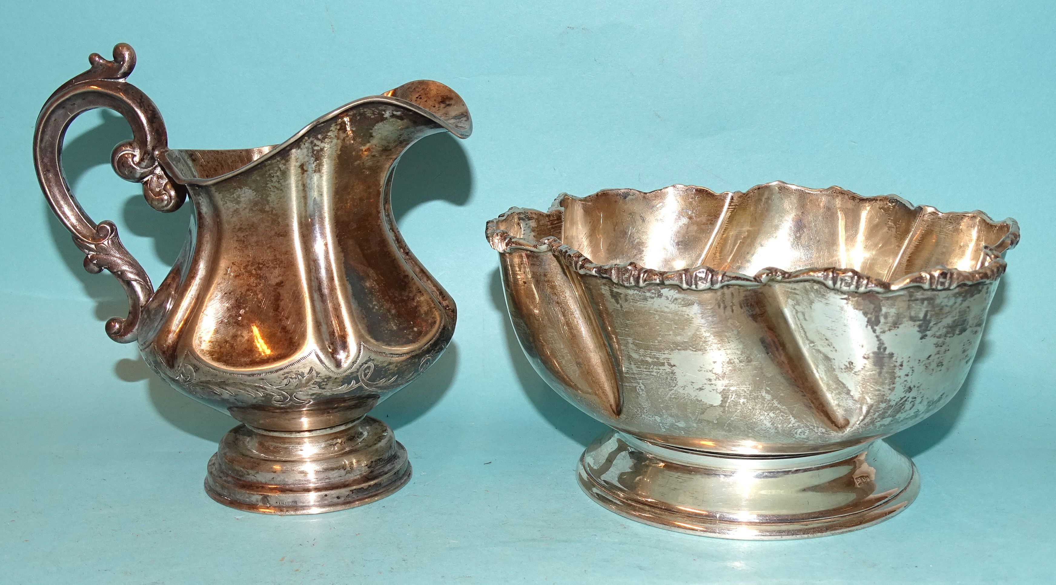 A Middle Eastern white metal lobed bowl on circular foot, bearing Egypt silver marks and a white