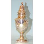 A silver sugar sifter of urn form with applied swag and tassel decoration, raised on square foot,