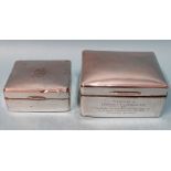 Two silver cigarette boxes with slightly-domed lids, both with engraved inscriptions, 11 x 9 x 5cm