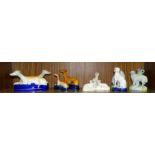 A collection of four Staffordshire ceramic greyhound pen holders, various sizes and other