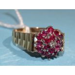 A 9ct gold ruby and diamond cluster ring, size R, 3.9g.