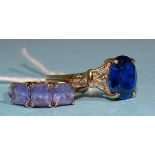 A 9ct gold ring claw-set three square-cut Tanzanites, size P, 2.1g and another 9ct gold ring set