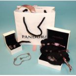 Pandora, a silver charm bracelet with four silver-mounted glass charms and five others, with two